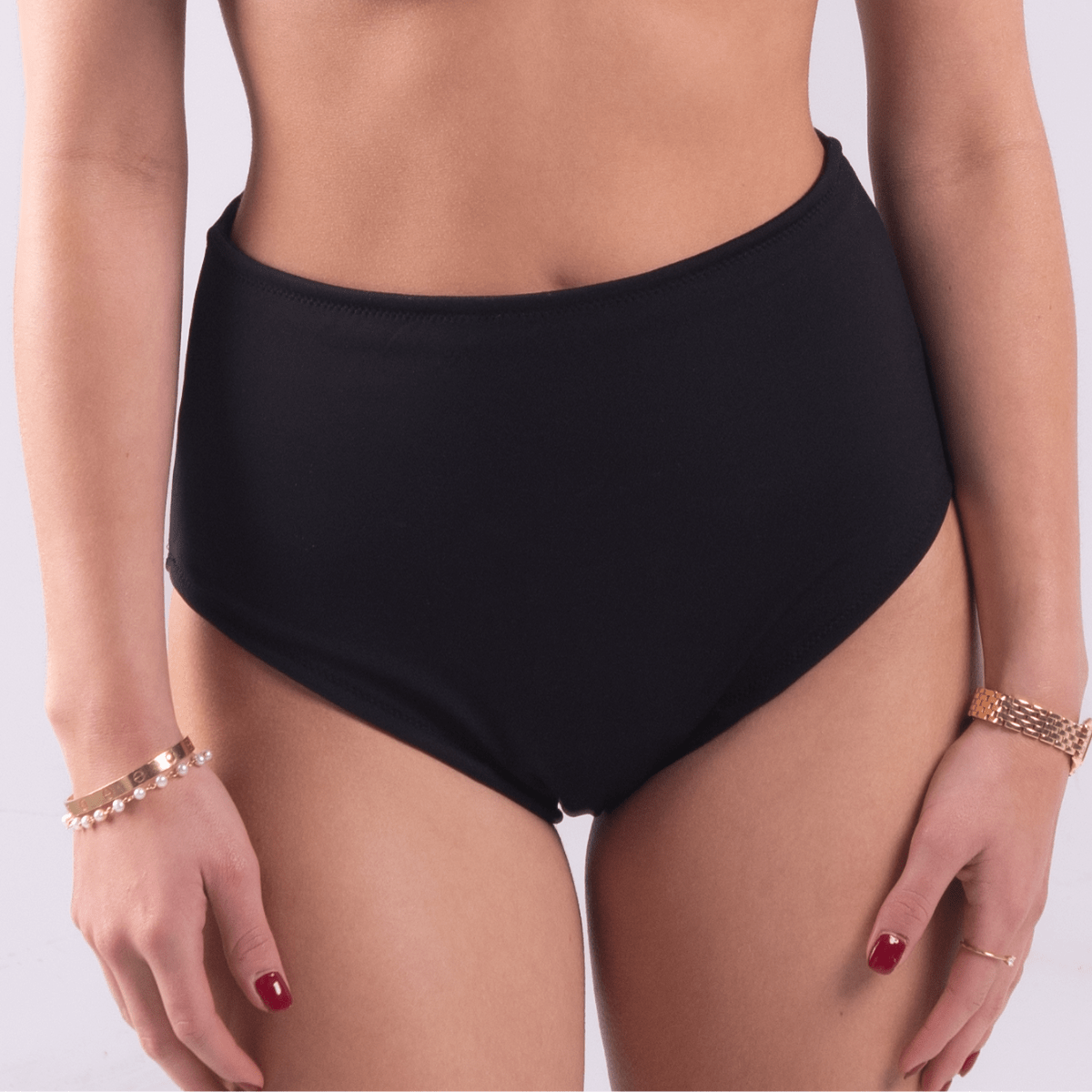 Teen wearing period swim crop top and bikini bottom set